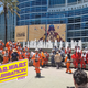 Cosplayers dressed as Rebel pilots in front of the convention center for Star Wars Celebration 2022.